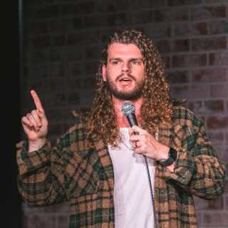 Mark Gagnon stand-up comedian performing live on stage in New York City