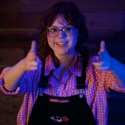 Charity Gregory performing stand-up comedy on stage